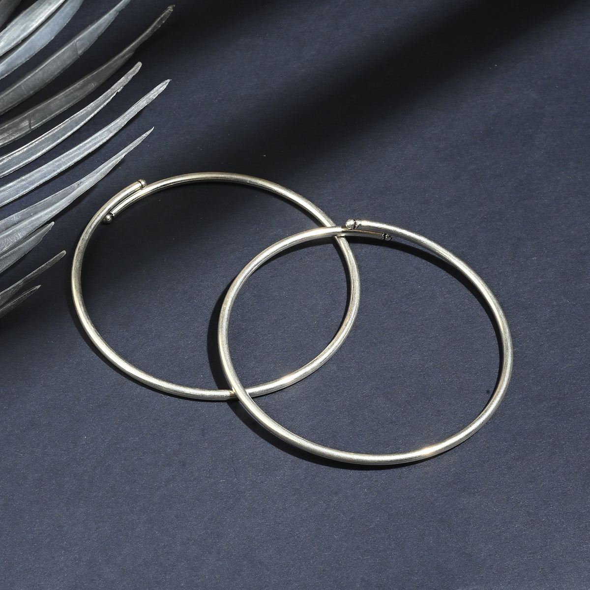 Close-up of traditional silver kada payal design detail
