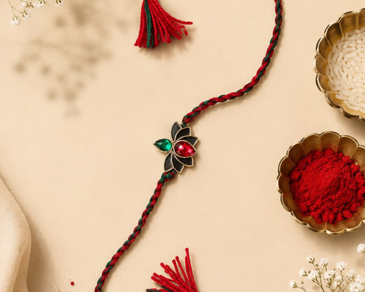 silver rakhi bracelet design emerald ruby lotus worn on wrist