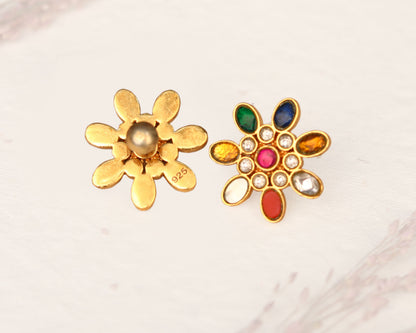 Woman wearing 925 silver floral stud earrings