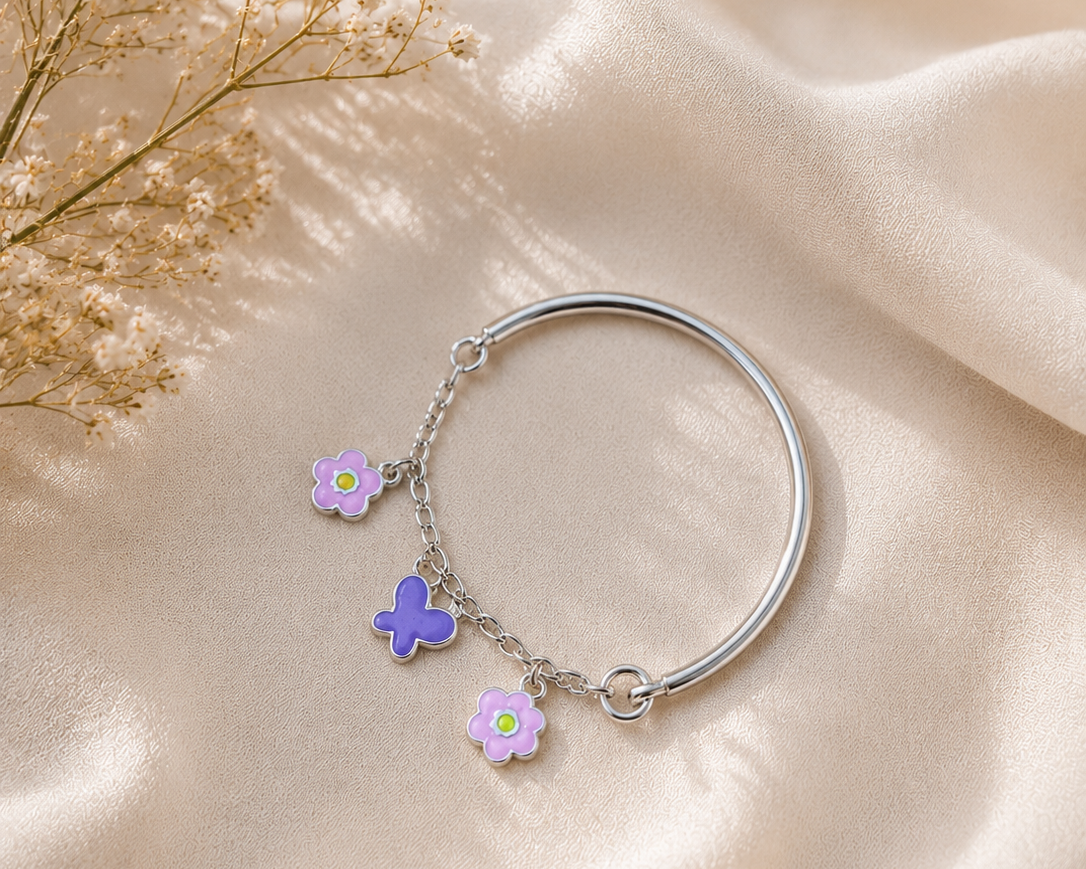child wearing silver butterfly charm bracelet