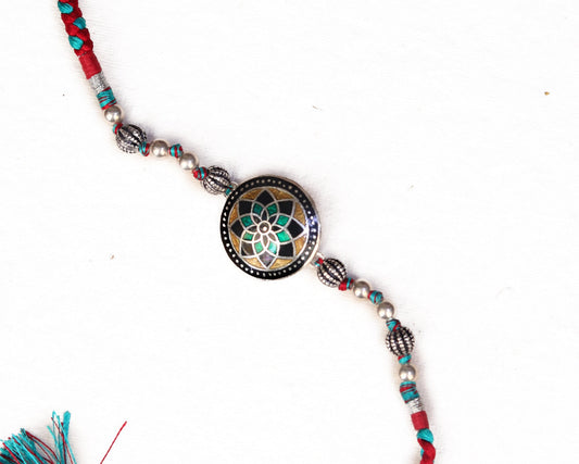 silver rakhi bracelet design mandala mosaic worn on wrist