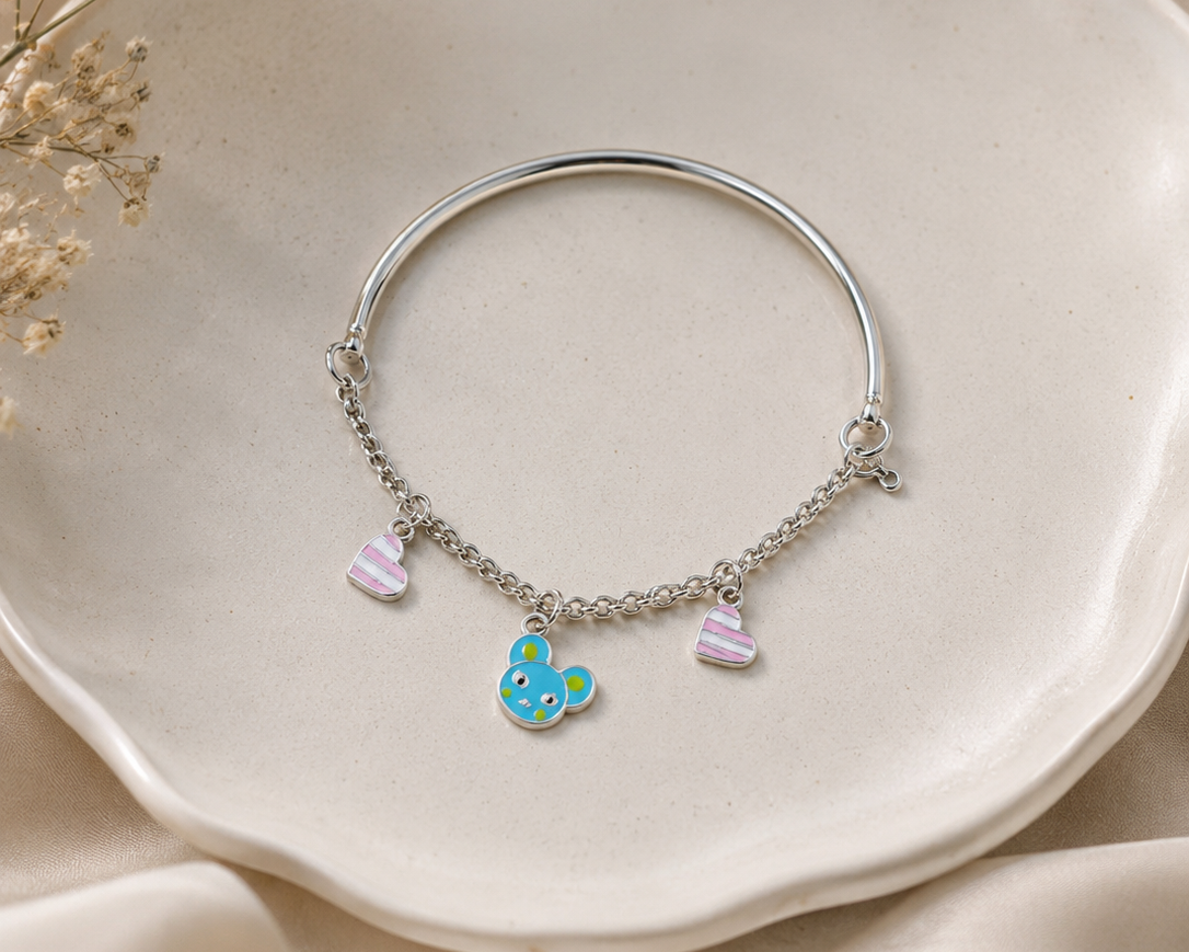 silver teddy bear charm close-up on bracelet